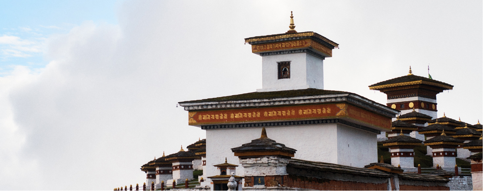 Bhutan Himalayan landscape banner showing Paro valley with traditional architecture