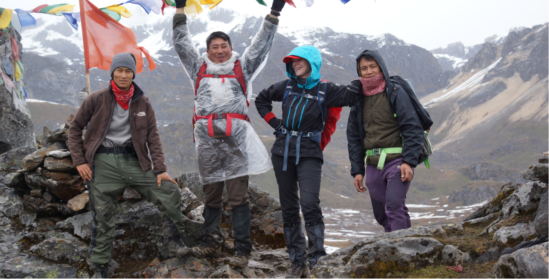 Bhutan Wilderness trekking team at mountain summit